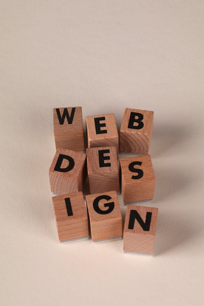 Mastering the First Impression: Your intriguing post title goes here Wooden blocks arranged to spell 'Web Design'. Perfect for creative, digital content themes.